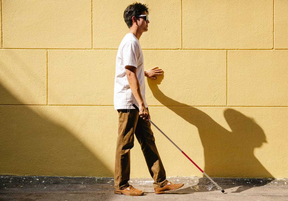 man walking with cane
